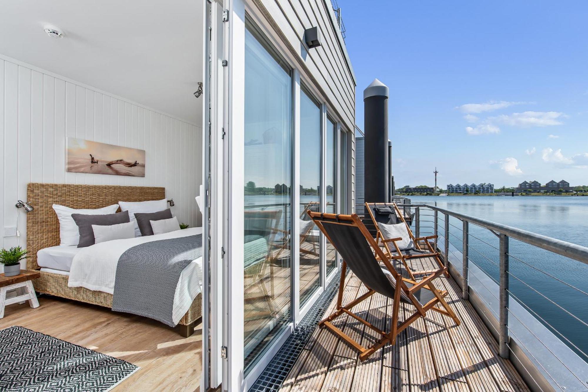 Holiday home Treibholz: Meerblick, Dachterrasse, Bootsanleger, Badeleiter, Sauna Olpenitz